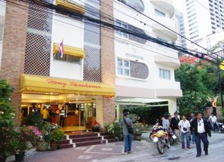 Residents gather outside the Hong Residence on Soi 4 after fearing there was a gas leak inside.